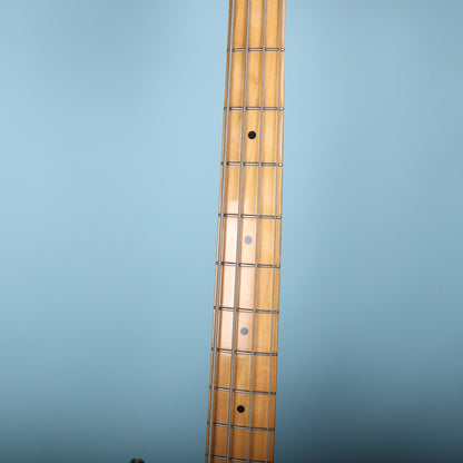 Close-up of the maple fretboard with black dot inlays on the Fender Precision Bass.