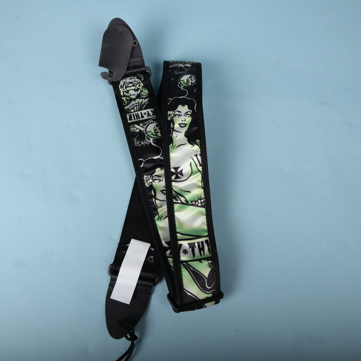 Folded view of the Dunlop Dead Island strap showing the back webbing and barcode tag.