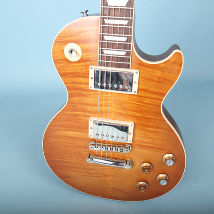 Close-up of the body top showing pickups, bridge, and mismatched control knobs