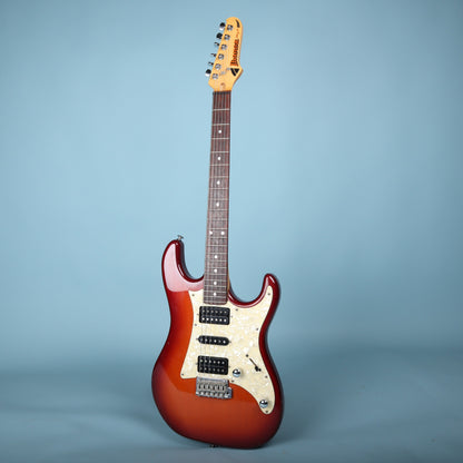 Full front view of Ibanez Blazer electric guitar in red sunburst with white pearloid pickguard.