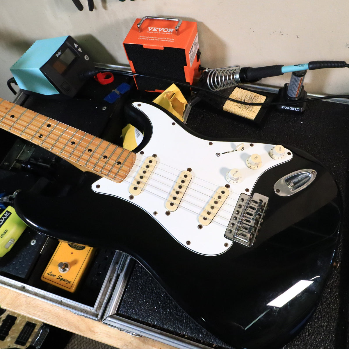 Workbench shot of the guitar body resting on a mat