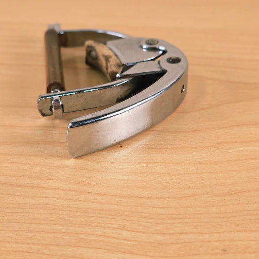 Side view of the closed Hamilton KB19A guitar capo showing the chrome lever mechanism.