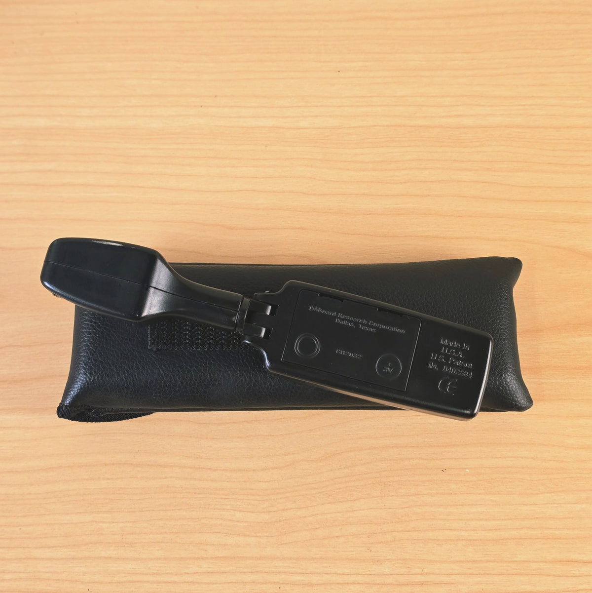 Rear view of The Intellitouch Tuner showing patent and battery compartment details.