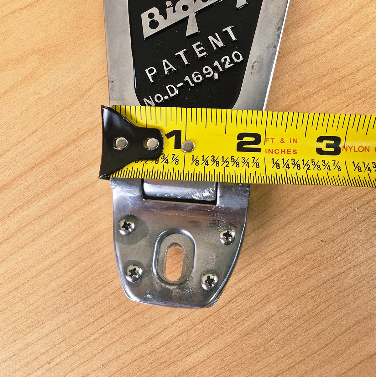 Width of the hinge bracket measured with a tape measure at approximately 2 inches.