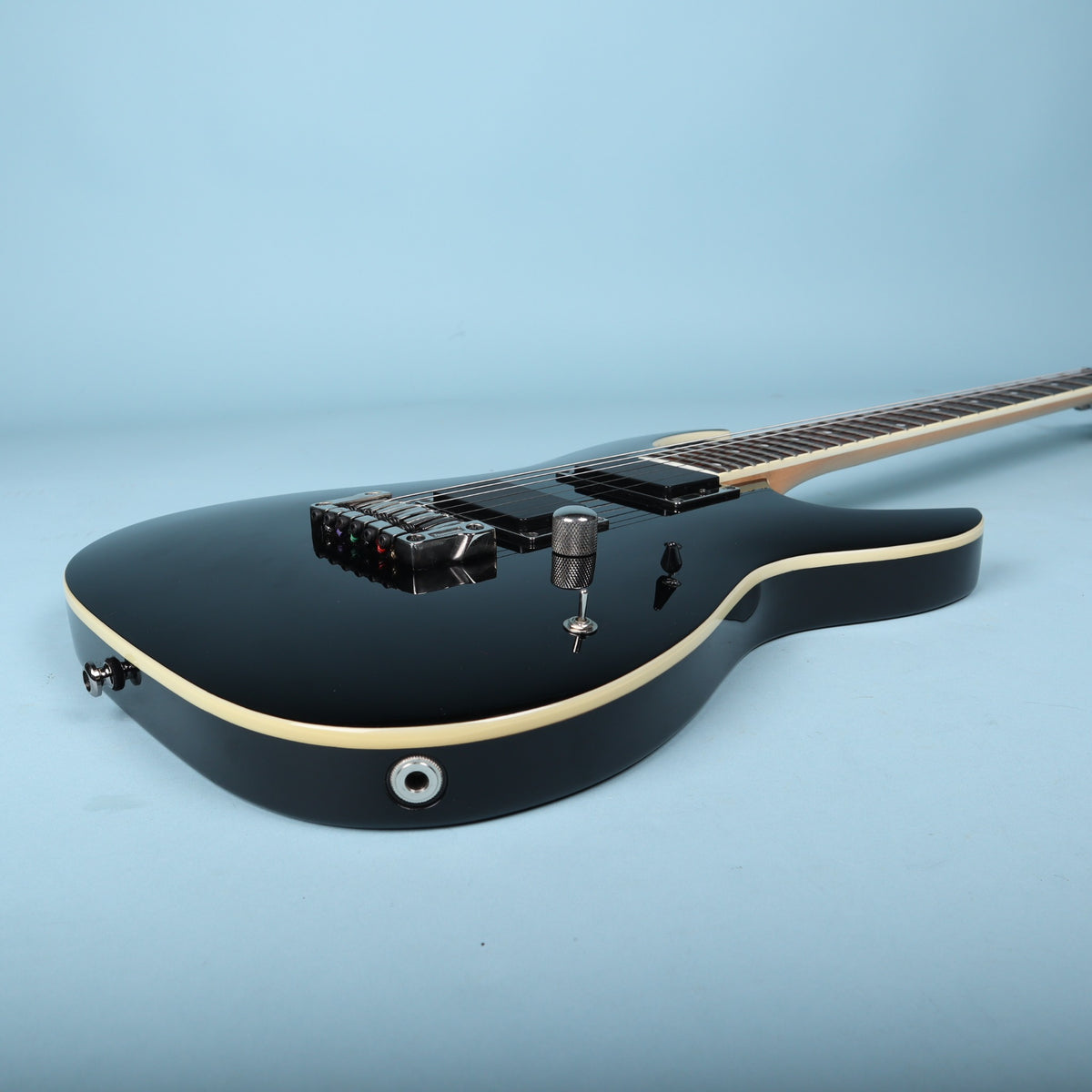 Side perspective view of Ibanez RGA42 body showing output jack and controls