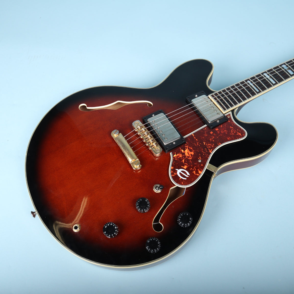 Angled view of guitar body controls