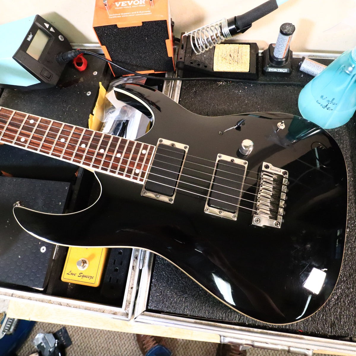 Ibanez RGA42 on bench showing active humbucking pickups and Gibraltar bridge