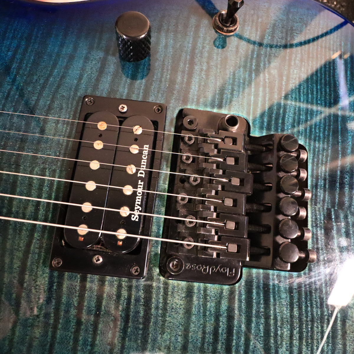 Close-up of Seymour Duncan pickups and Floyd Rose tremolo