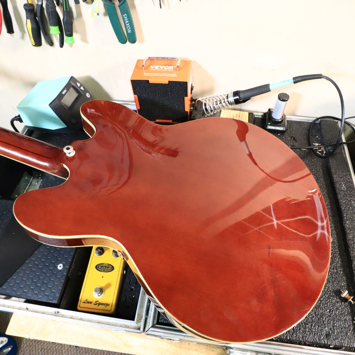 Rear view of guitar on workbench side angle 26/30 removed for brevity 25 removed for brevity 24 removed for brevity 23