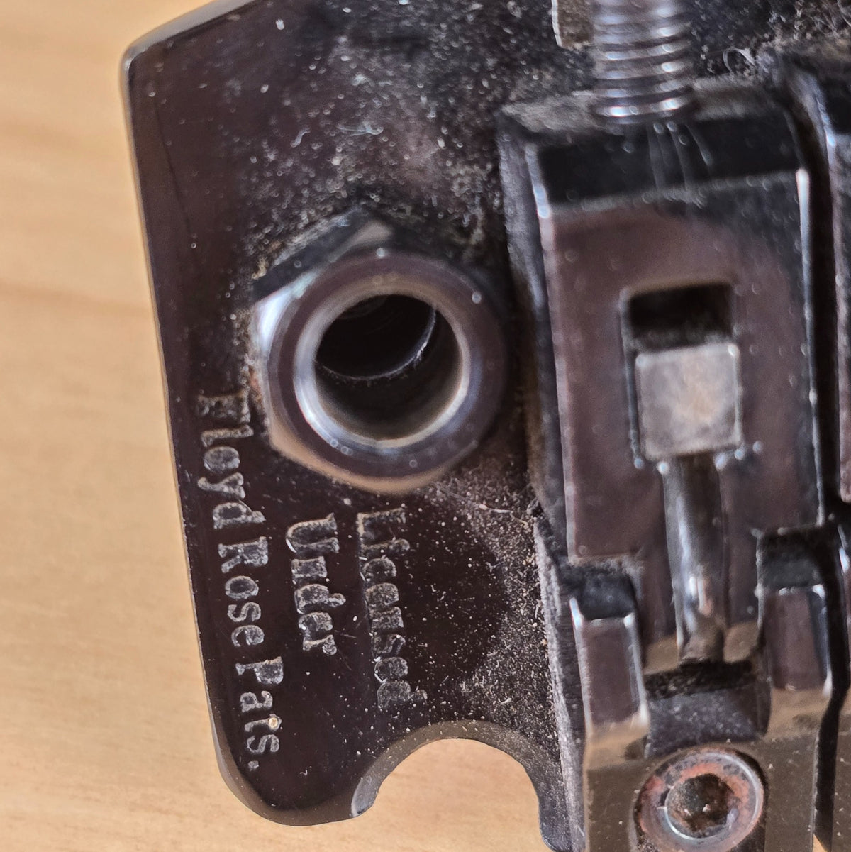 Close-up of Licensed Under Floyd Rose Pats stamping on baseplate