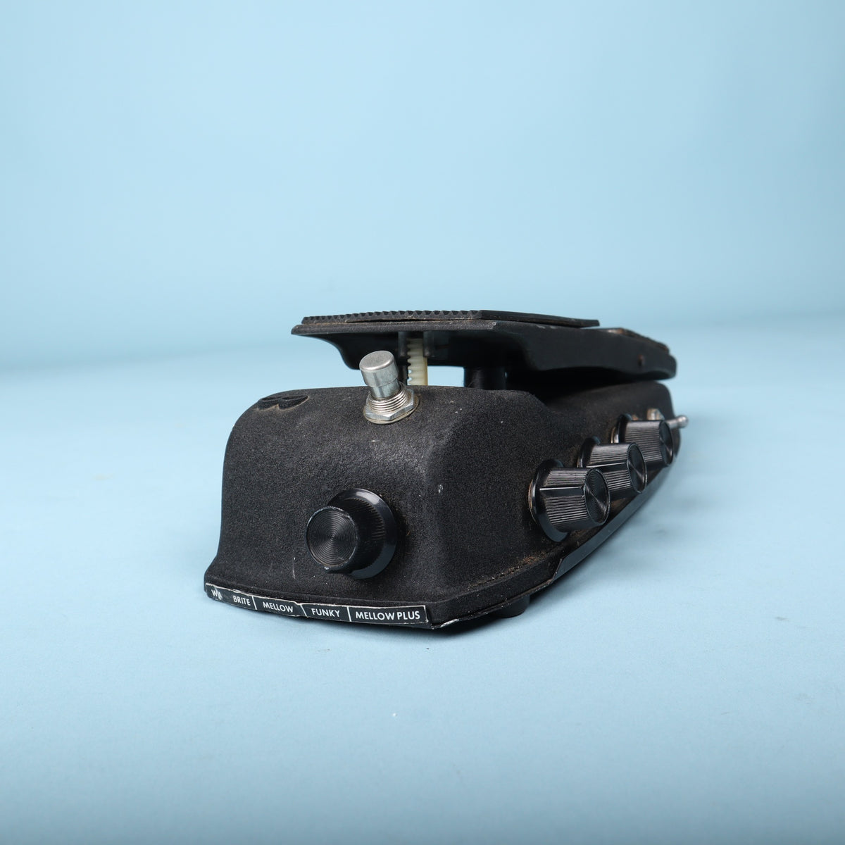 Angled front view detailing the rotary voicing selector and side control knobs