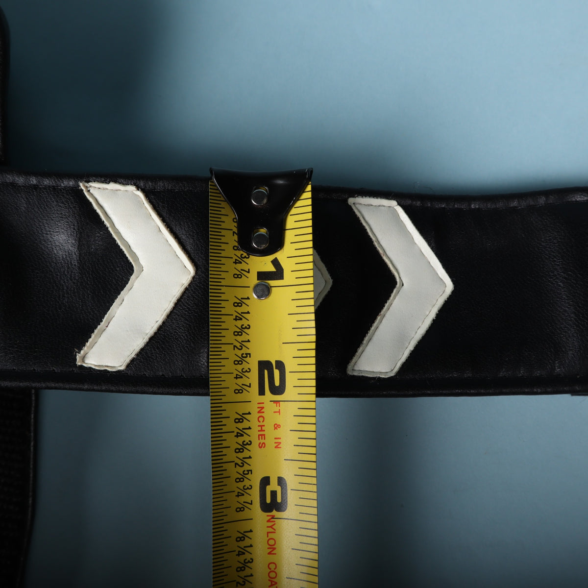 Tape measure across the strap showing a 2-inch width