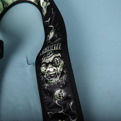Close-up detail of the ghoul face graphic and Lucky 13 branding banner on the strap.