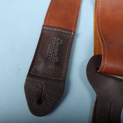 Close-up of the dark brown leather strap end stamped with Doctor Song Pick-Pocket Made in U.S.A.