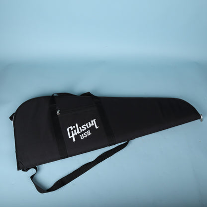 Full front view of the black Gibson USA gig bag showing the accessory pocket and shoulder strap.