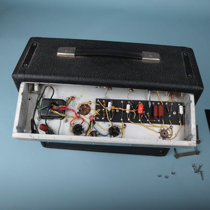 Overhead view of the opened chassis showing hand-wired eyelet board circuitry.