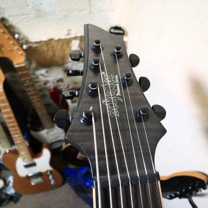 Detailed side view of the knurled master volume knob and three-way toggle switch