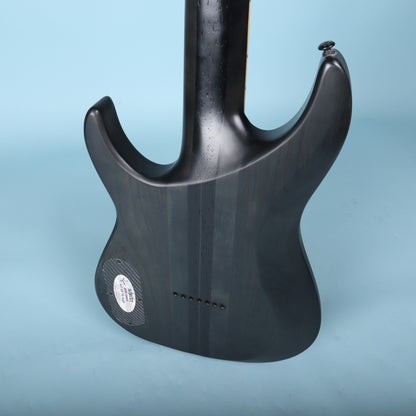 Close-up of the sculpted neck joint and string ferrules on the rear body