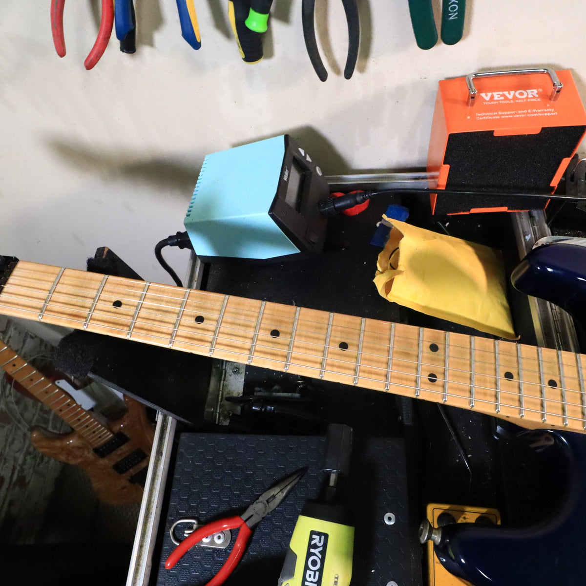 Fretboard and neck view on workbench