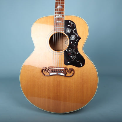 Front view of 1993 Gibson J-200 acoustic guitar body showing spruce top, pickguard, and mustache bridge.