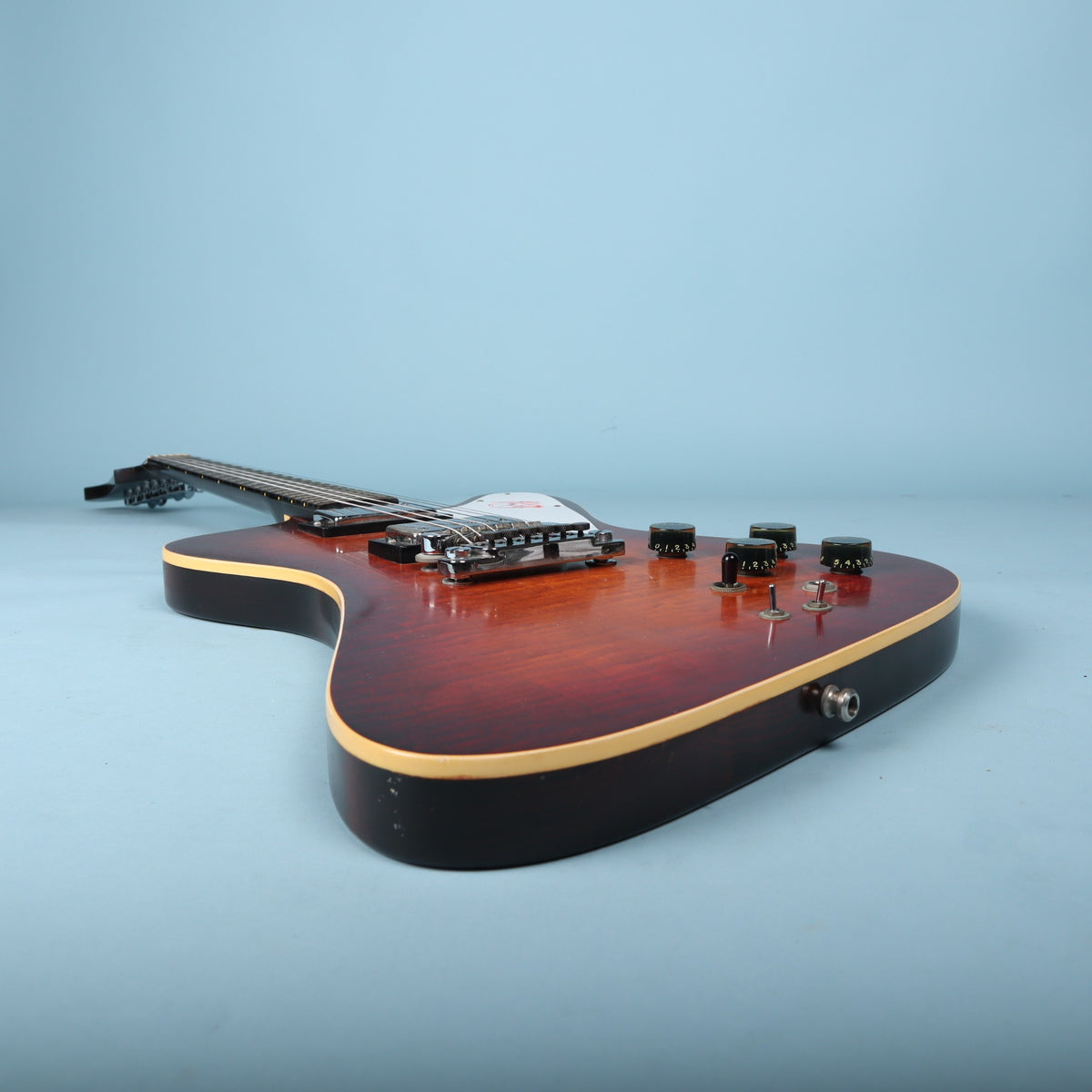 Perspective view looking from the bottom strap button along the guitar body toward the neck.