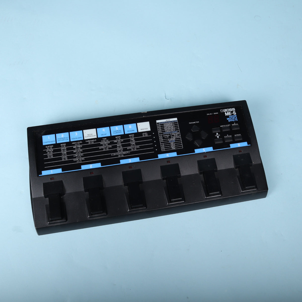 Full overhead view of the Boss ME-6 multi-effects floorboard