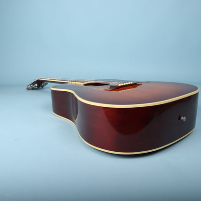 Side profile view of the dreadnought guitar body lying flat.