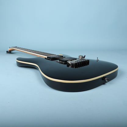 Bottom perspective view of Ibanez RGA42 arched body contour and hardtail bridge
