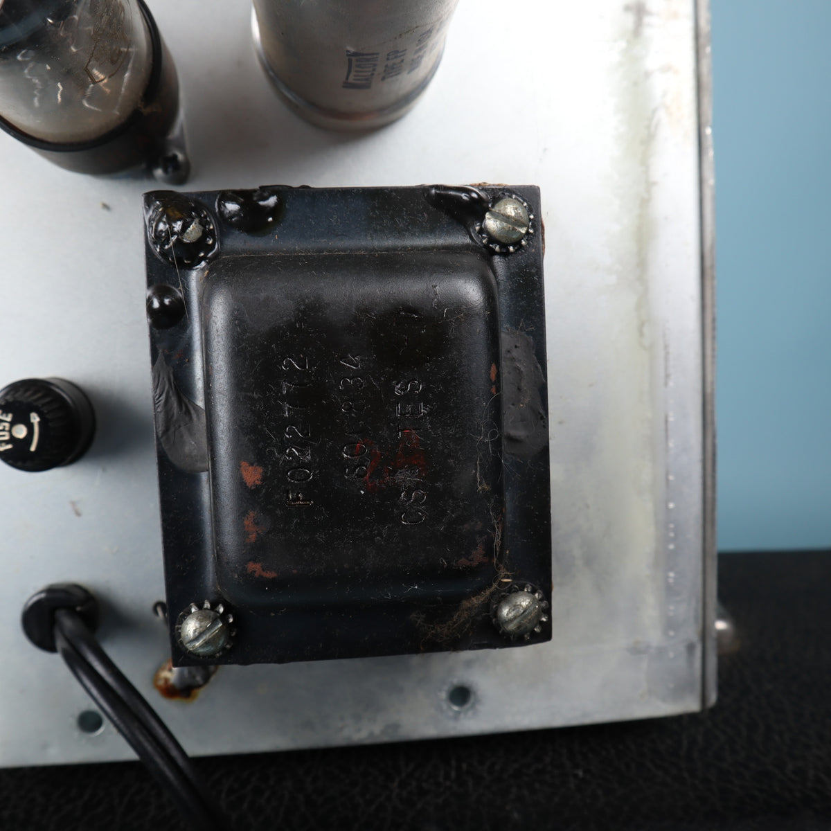 Close-up view of the Schumacher output transformer with date code 606-8-26.