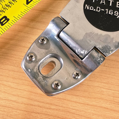 Close-up of the hinge bracket showing surface oxidation and screw details.