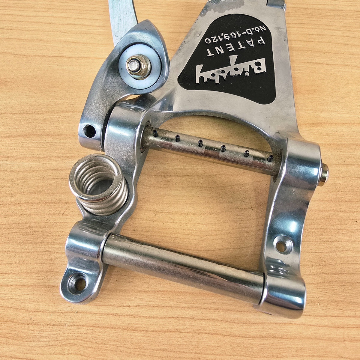 Detailed view of the string posts, tension roller, and vibrato spring.