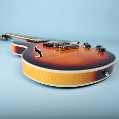 Low-angle view looking up the guitar body from the bottom strap button.
