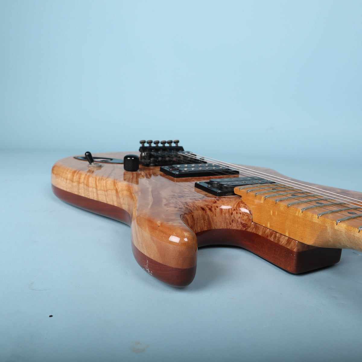 Underside of DiMarzio DP153 bridge humbucker pickup showing label and model number stampers. DP153 FRED model stamped on