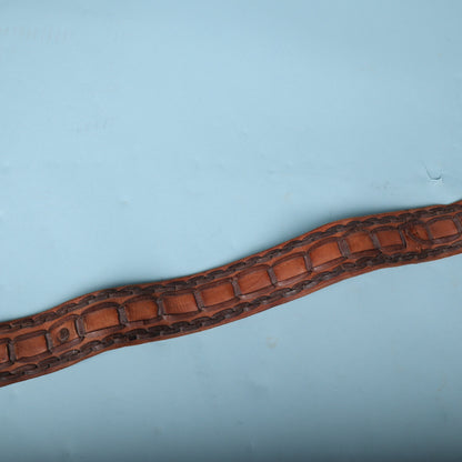 Overhead view of laced leather section showing surface texture and patina