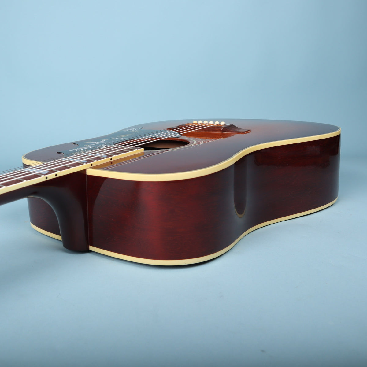 Side view showing the neck-to-body joint and upper bout.