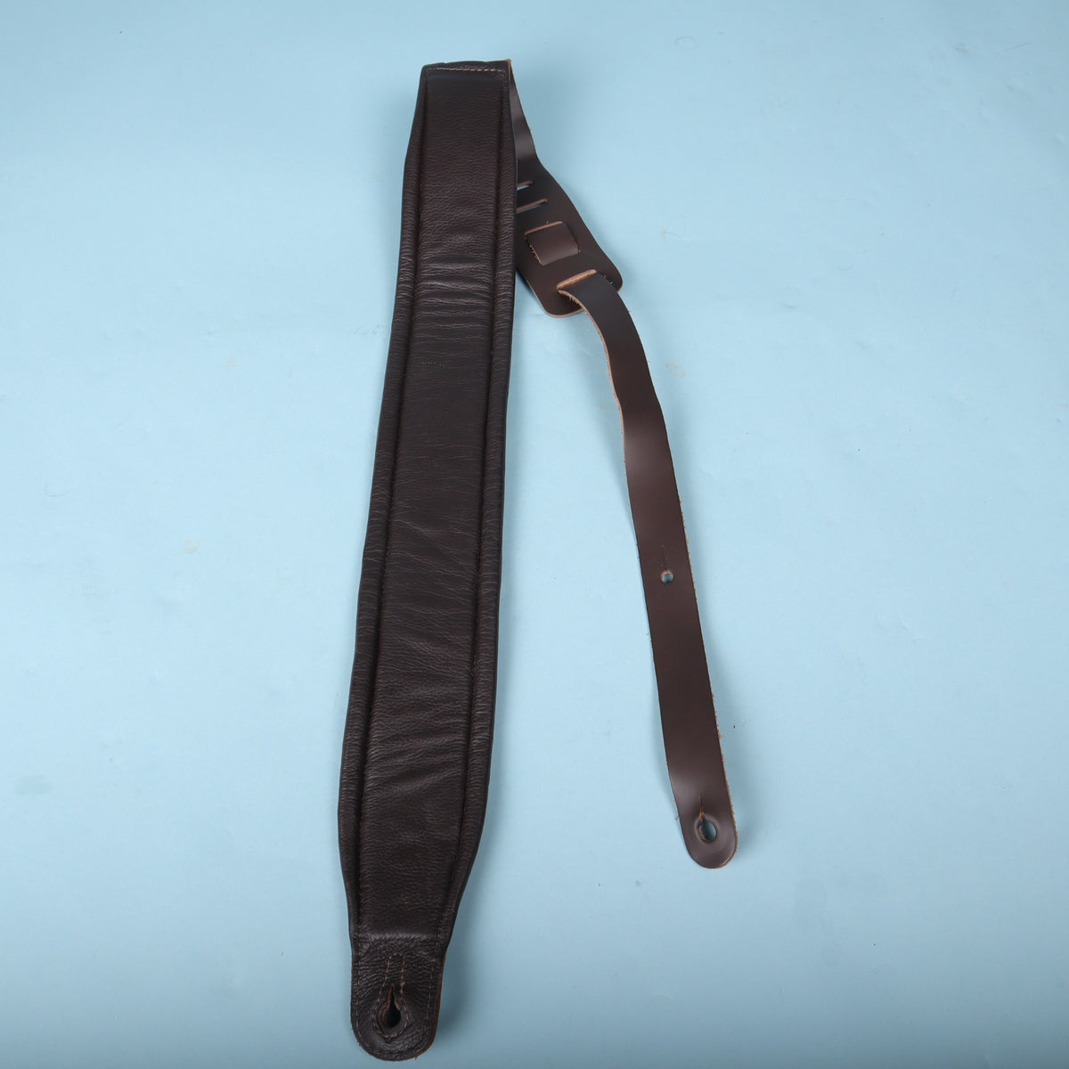 Reverse side of the strap showing the soft padded backing and ladder adjustment tail
