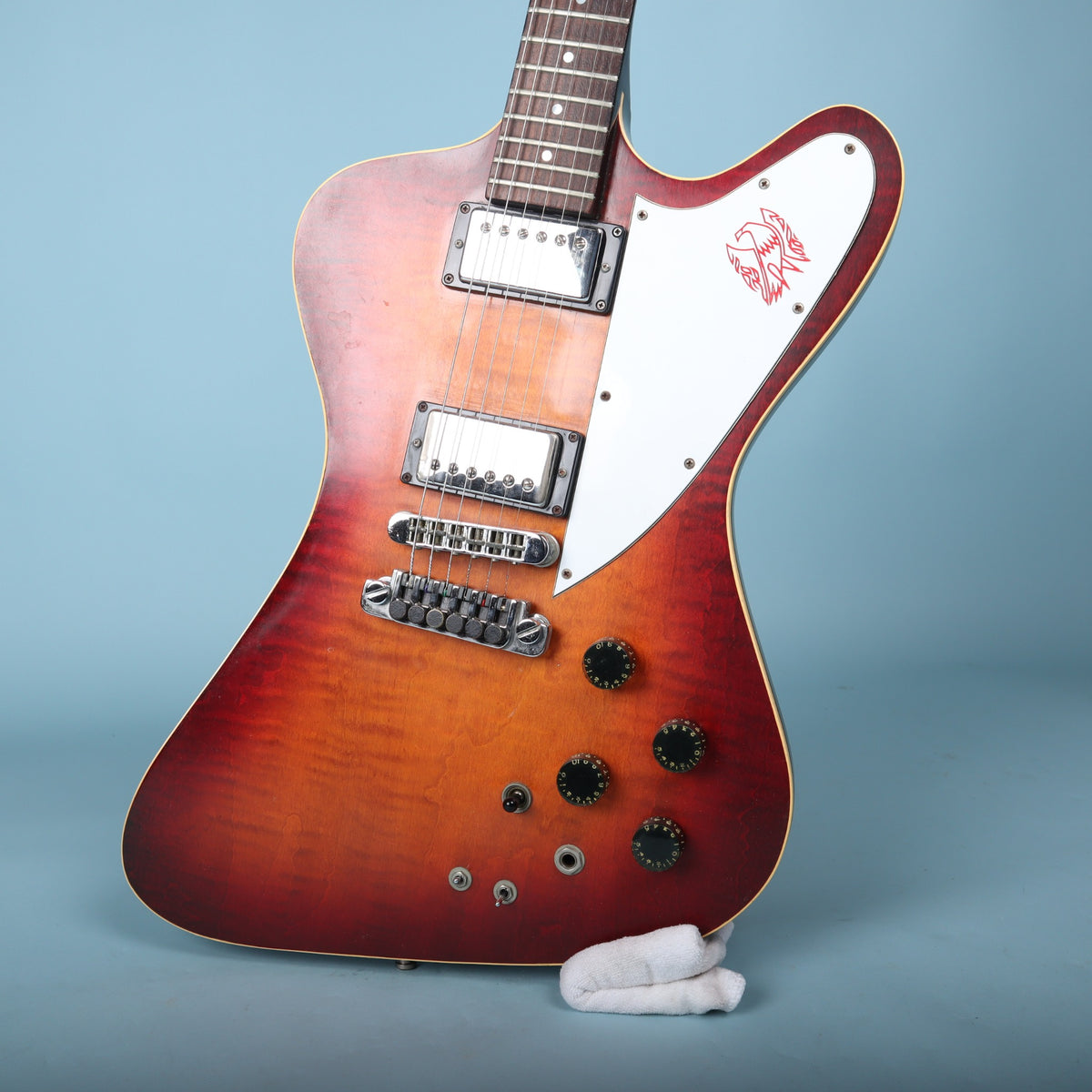 Front view of the sunburst body resting upright on a stand.