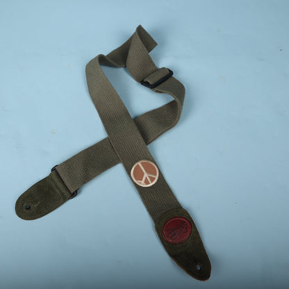 Levy's olive green cotton guitar strap displayed against a light blue backdrop