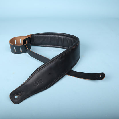 Levy's black padded bass strap showing embossed logo and end pin hole detail.