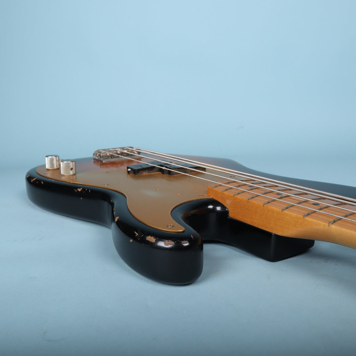 Side view of the lower cutaway rim showing finish checking and wear.