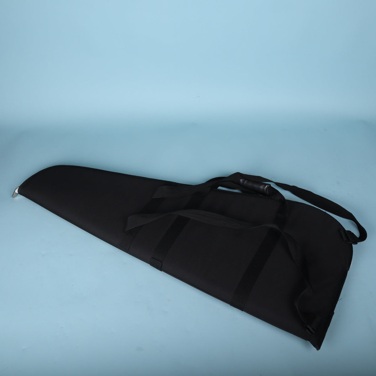 Back view of the black Gibson gig bag showing the carry handles and harness webbing.