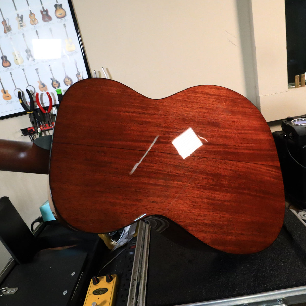 Gloss mahogany back of the Martin 0-18 body on a workbench.