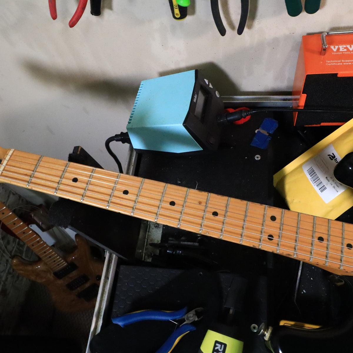 Workbench shot of the maple fretboard