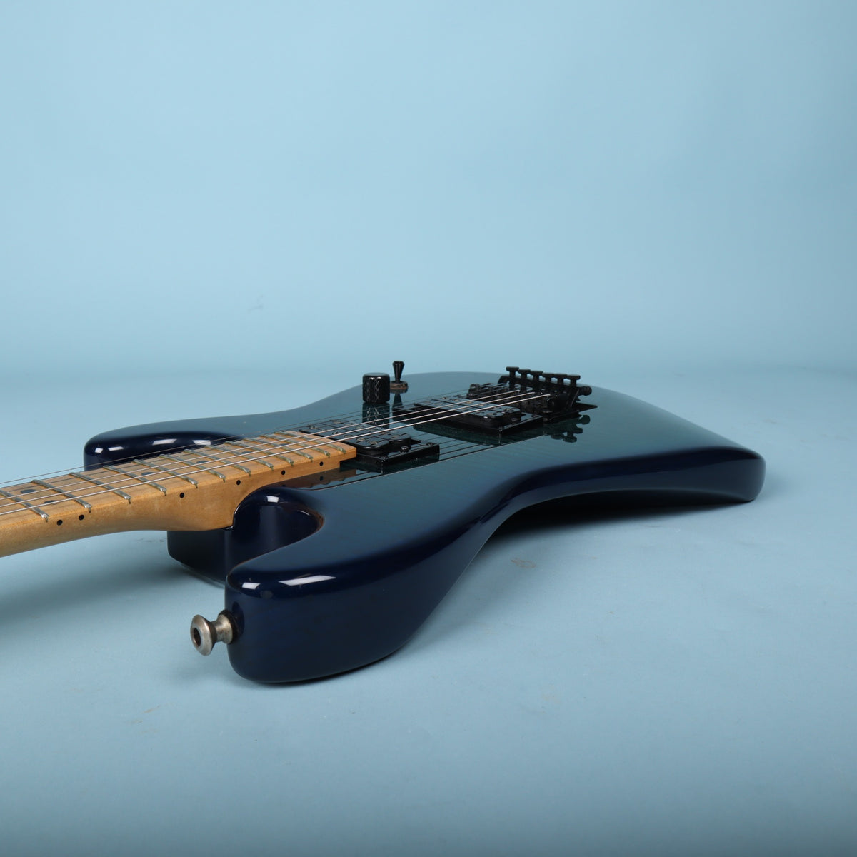 Side view of guitar body and upper horn
