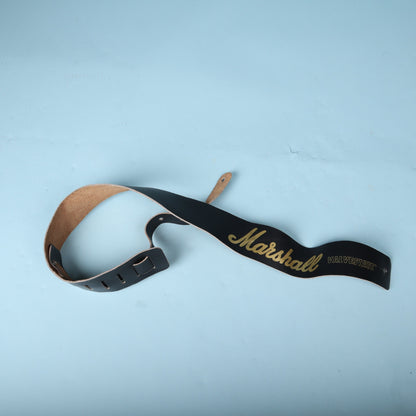 Angled view of the coiled Marshall Valvestate guitar strap showing both ends