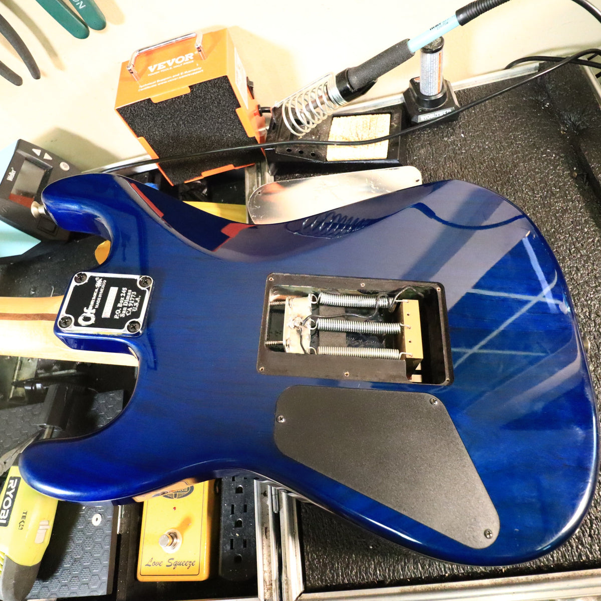 Rear body cavity and tremolo springs on workbench