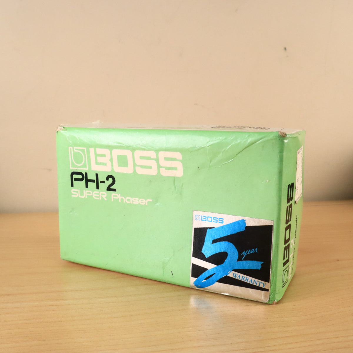 Top panel of the BOSS PH-2 Super Phaser box featuring blue 5-year warranty sticker.