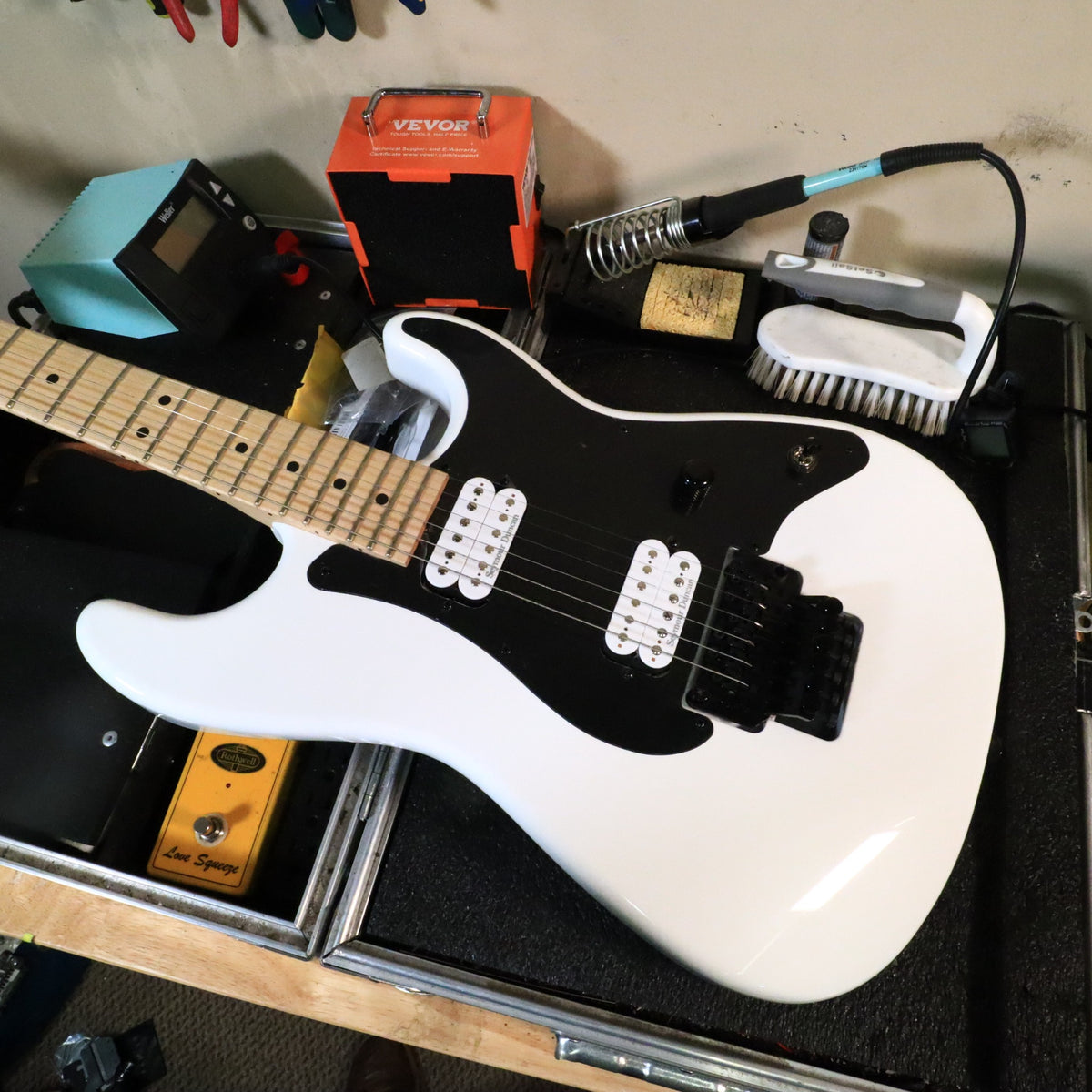Headstock front view on tech bench under workshop lighting.