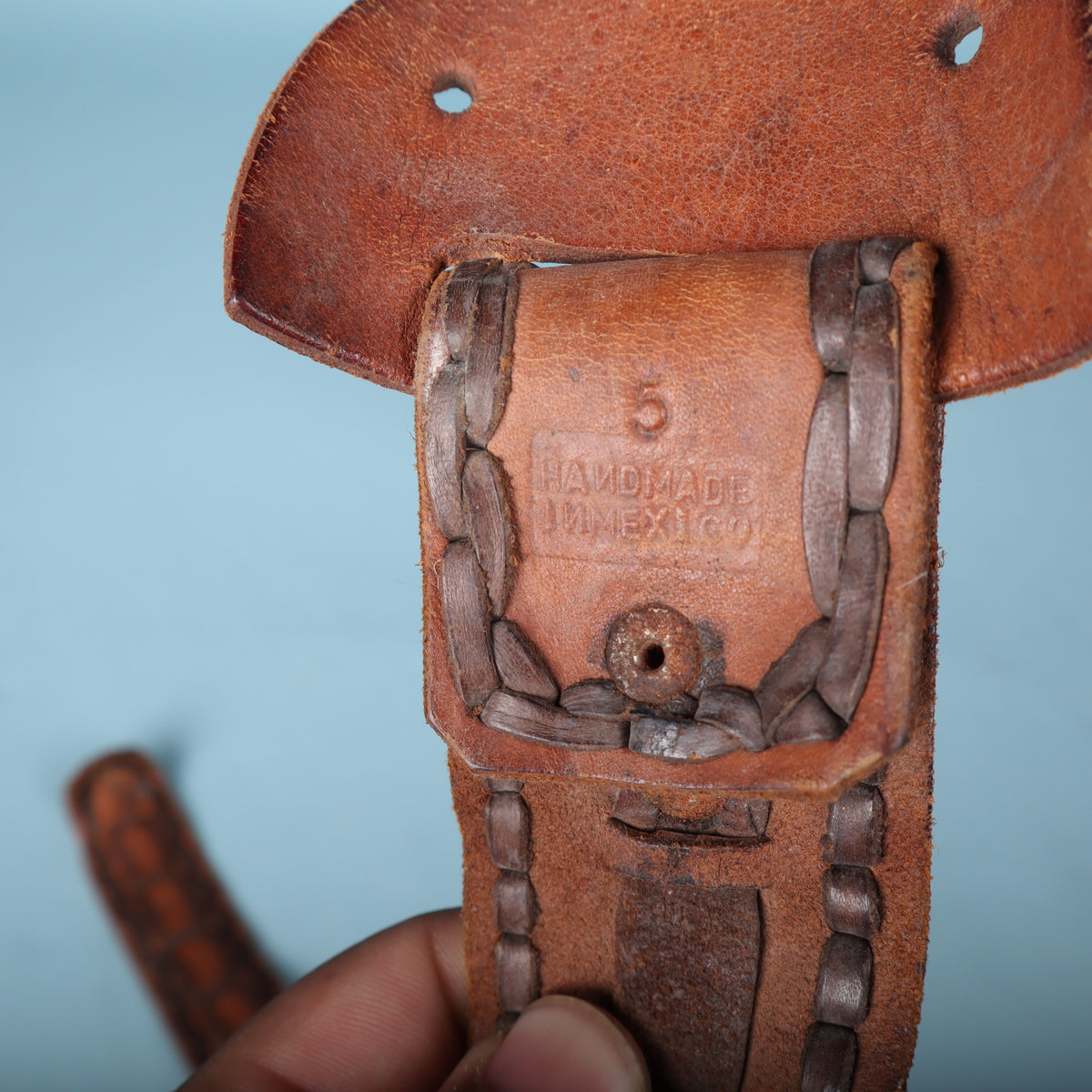 Close-up of leather keeper stamped Handmade in Mexico with number 5