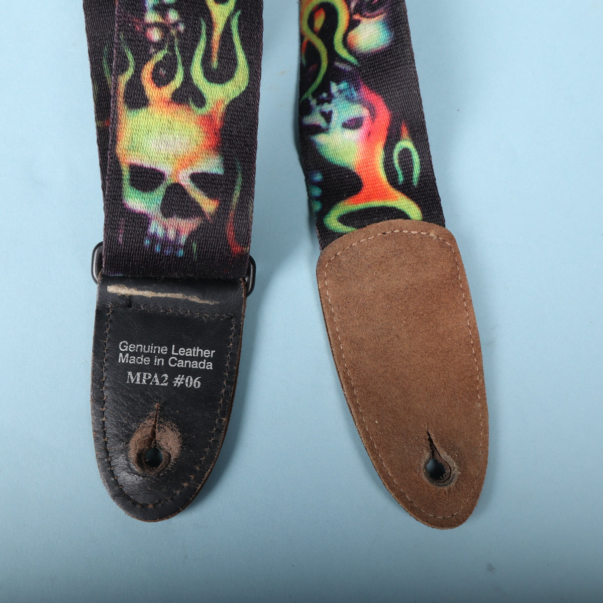 Backside of both leather ends showing Canada MPA2 #06 stamp and suede backing.